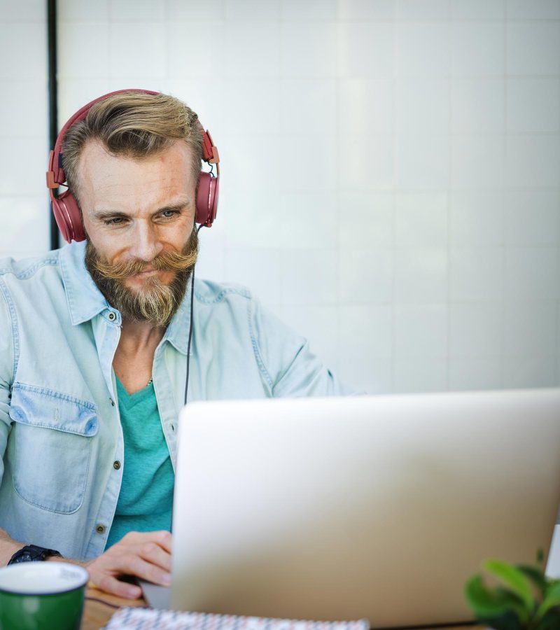 man-laptop-music-streaming-relaxation-technology-c-PNBQ7QB.jpg